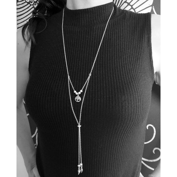 Collar corbatero en plata 925 con dije de árbol de la vida y alas.