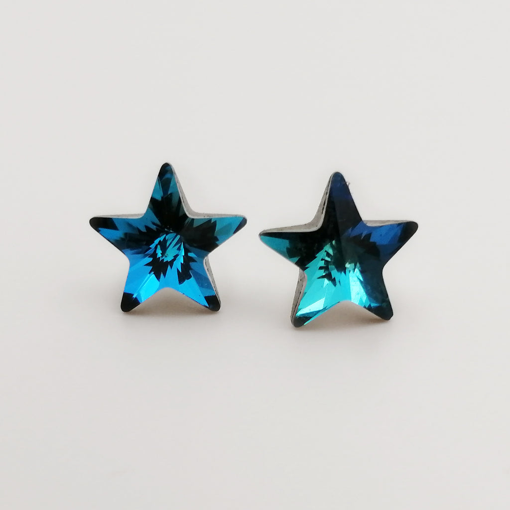 Aretes con cristal azul en forma de estrella en plata 925
