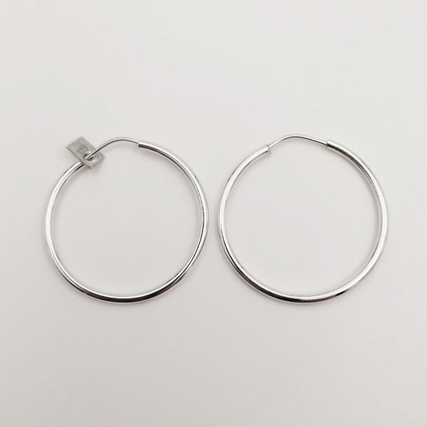 Argollas lisas tubular medianas en plata 925