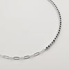 Detalle de collar "paper clip" & tenis con circones negros en plata 925