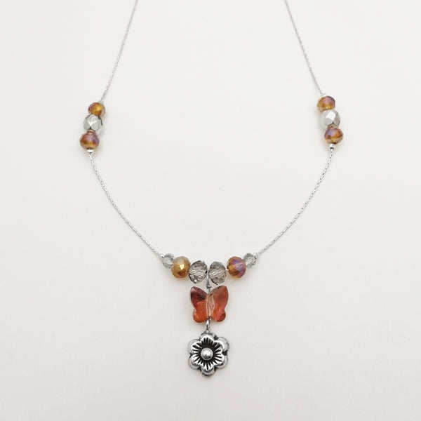 Collar en plata 925 con mariposa, cristales y flor bruñida