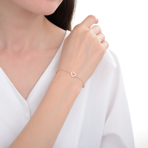 Pulsera con corazón hueco con circones en plata 925 con baño de oro rosado